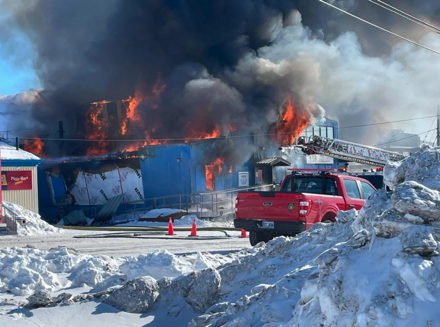 <who> Photo credit: Canadian Press/Nunatsiaq News-Dave Lochead </who> The building that houses Nunatsiaq News in Iqaluit was destroyed by fire Tuesday as shown in this handout photo provided by the newspaper.