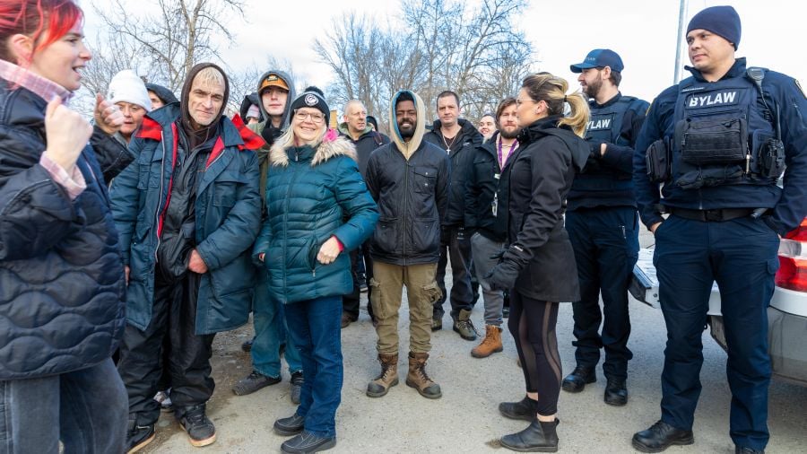 <who>Photo Credit: NowMedia/Gord Goble</who> Linda Sankey (blue jacket, toque) amongst the group