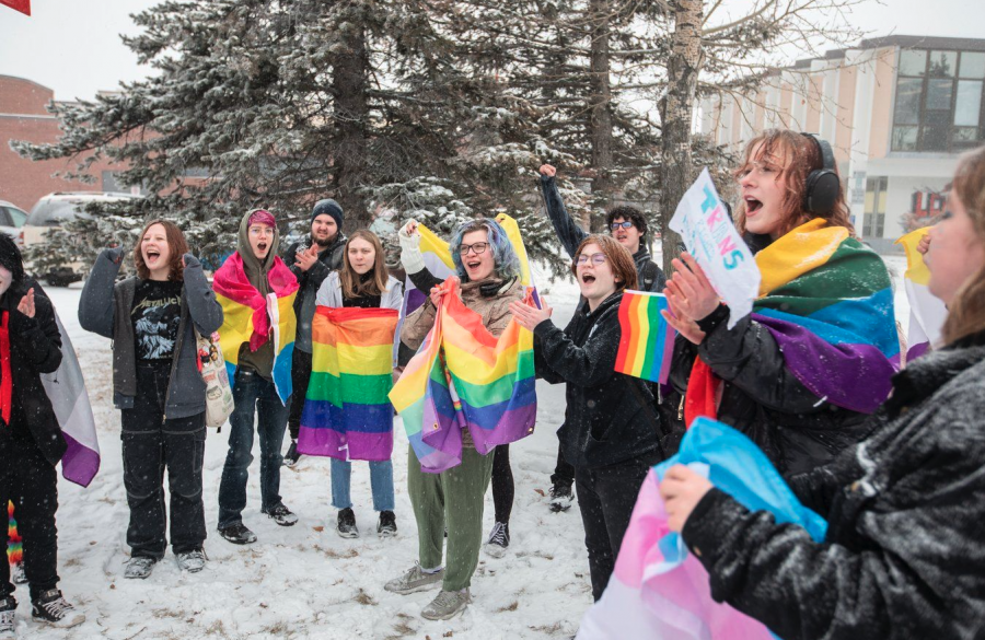 <who> Photo credit: Canadian Press/Amber Bracken </who> Students walk out of Leduc Composite High School to protest sweeping gender policies announced by the UCP in Leduc, Alberta.