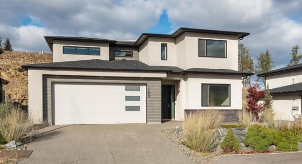 <who>Home photo credits: Realtor.ca</who>This four-bedroom, three-bathroom, 2,490-square-foot house on Acadia Street is listed for sale for $1,049,000, which is just a little more than the $1,045,700 benchmark selling price of a typical single-family home in Kelowna in December.