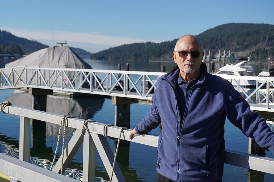 <who> Photo Credit: Patrick Penner-Local Journalism Initiative Reporter-Tri-Cities Dispatch</who> Dennis Nisbet, a retired Realtor, standing on his dock on Alderside Road. 