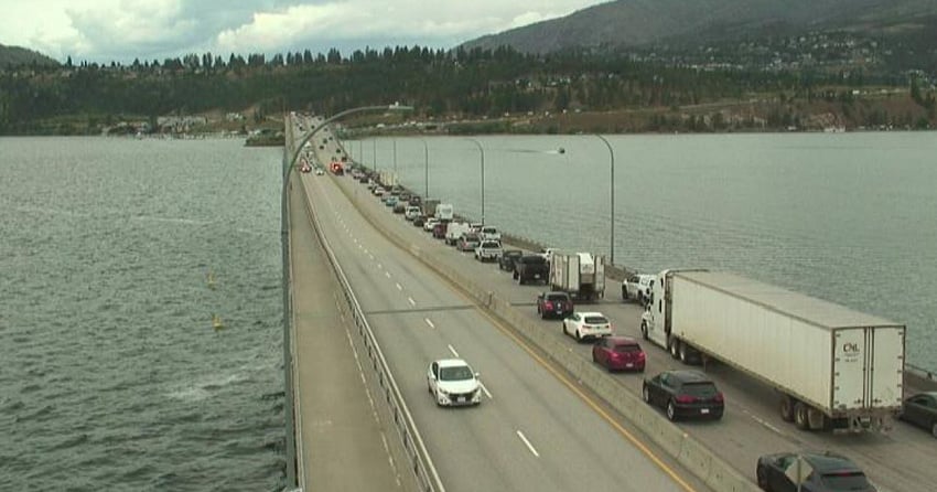 <who>Photo Credit: DriveBC</who>A webcam image shows emergency crews responding to the incident on the Bennett Bridge as westbound traffic backs up.