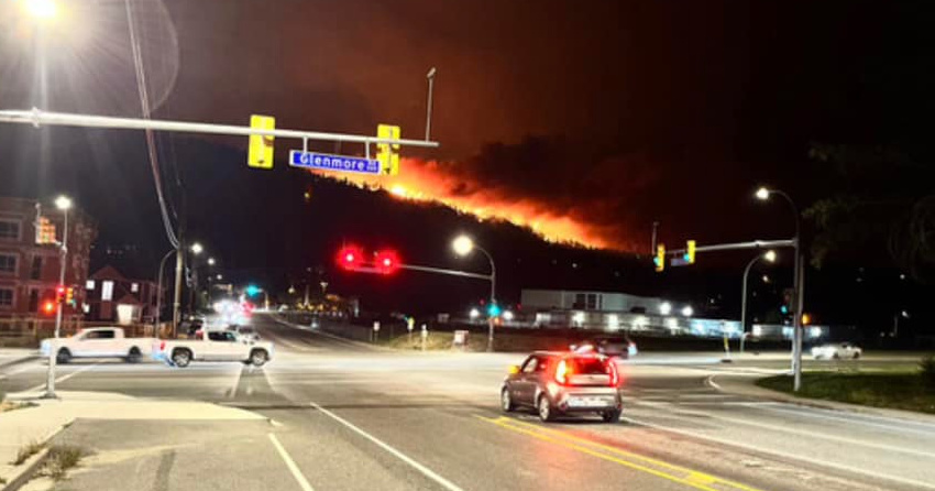 <who>Photo Credit: Tyler L'Esperance</who>Thousands were evacuated in Glenmore and Lake Country shortly before midnight after the fire jumped Okanagan Lake.