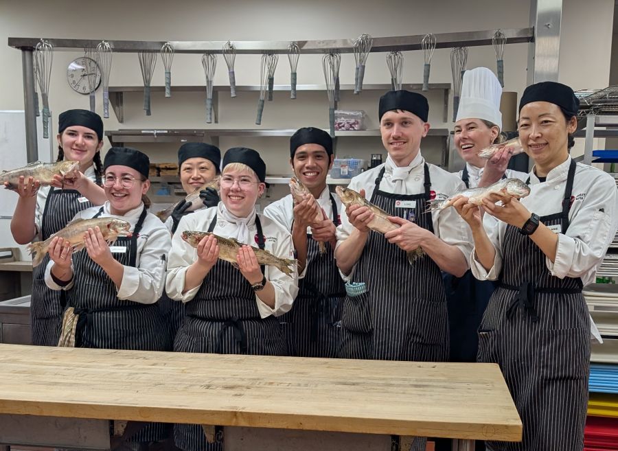 <who>Photo Credit: Contributed</who>Okanagan College culinary arts students with Chef Kelsey Oudendag
