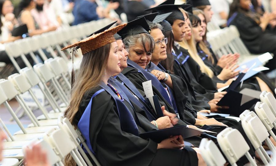 <who>Photo Credit: UBCO</who>Angelina Hopkins-Rose, Rena Patrick, Deborah Doss-Cody and Audrey Casper wait for their names to be called during convocation ceremonies at UBC Okanagan on Thursday afternoon. The four make up the inaugural graduating cohort of the Bachelor of St’át’imc Language Fluency.