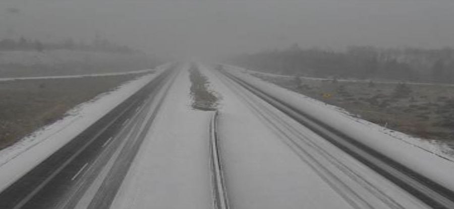 <who>Photo Credit: DriveBC webcam</who>Snow on Hwy 5 between of Kamloops and Merritt around 9:20 am.