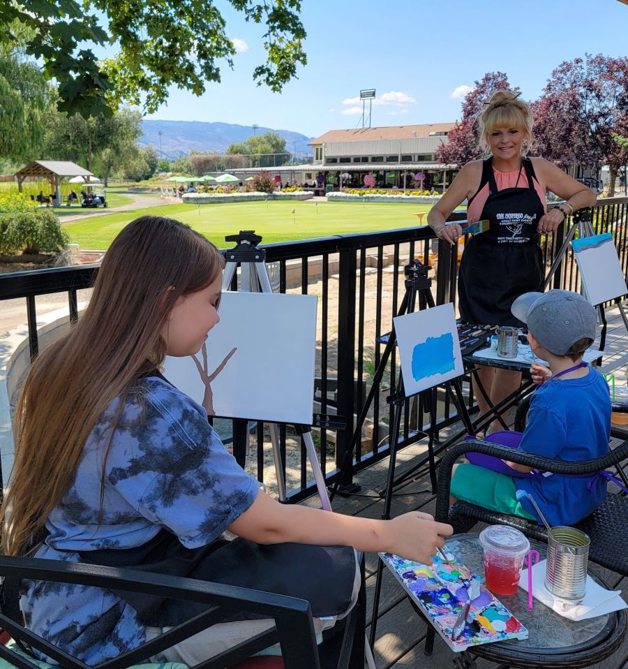<who>Photo Credit: Contributed</who>Tracy Thring with her grandchildren at an Opus outdoor art event in 2021. Thring loved to share her creativity and love of art with others and ran many At Home Paint Parties later in her life.